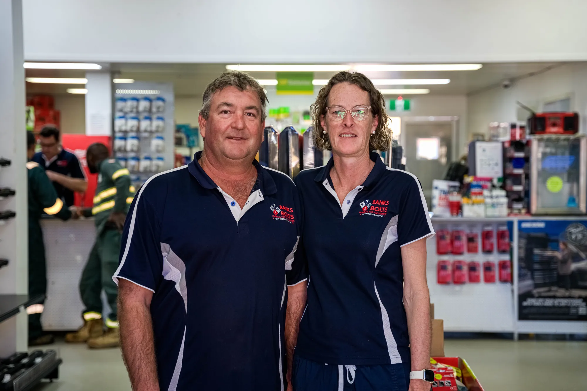 Two of the Banks Bolts team smiling in the store